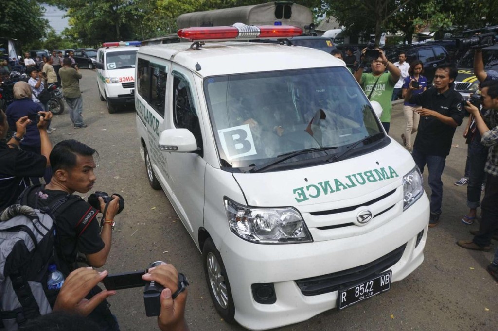 A convoy of ambulances carrying coffins make their way to Nusa Kambangan prison at Wijayapura quay