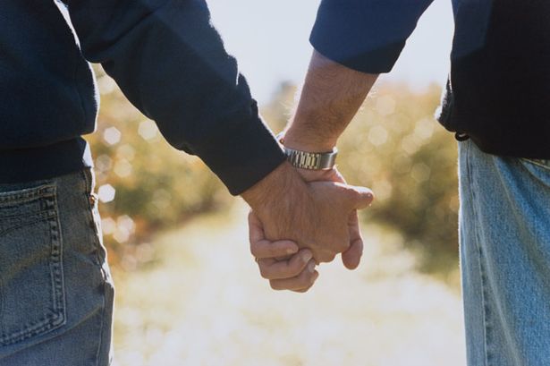 Two-Men-Holding-Hands-812874